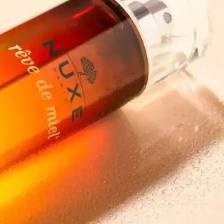Nuxe Reve De Miel Body Spray - 3.38 fl oz, Orange Blossom & Sandalwood Fragrance for Women Nuxe Reve De Miel Body Spray - Orange Blossom & Sandalwood Nuxe Reve De Miel, Body Spray, Fragrance, Perfume Spray, Orange Blossom, Sandalwood, Tonka Bean, Women's Fragrance, Long Lasting Scent, Floral Fragrance, Woody Fragrance, Luxurious Fragrance, Daily Skincare, Confidence Boost, Romantic Gift, Everyday Fragrance