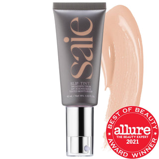 Saie Slip Tint - Lightweight Tinted Moisturizer with Mineral Zinc SPF 35 & Hyaluronic Acid, Non-Comedogenic & Cruelty-Free Saie Slip Tint: SPF 35 Tinted Moisturizer with Hyaluronic Acid tinted moisturizer, SPF 35, non-comedogenic, mineral zinc oxide, hyaluronic acid, lightweight coverage, fragrance-free, dermatologist-tested, cruelty-free, gluten-free, Saie, Slip Tint, natural makeup, everyday makeup, sun protection, hydration, radiant finish, dewy finish, liquid formulation, eco-friendly packaging, recycla