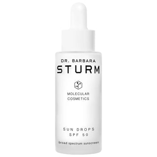 Dr. Barbara Sturm Sun Drops Face Sunscreen SPF 50: Lightweight, Anti-Aging & Broad Spectrum Protection for Sensitive Skin Dr. Barbara Sturm Sun Drops SPF 50: Anti-Aging Face Sunscreen Sun Drops Face Sunscreen SPF 50, lightweight sunscreen serum, SPF 50 sun protection, sunscreen for sensitive skin, anti-aging sunscreen, broad spectrum sunscreen, cruelty-free sunscreen, hyaluronic acid sunscreen, sunscreen with green tea extract, face sunscreen, sun protection, skincare, anti-aging, sensitive skin, UVA protec