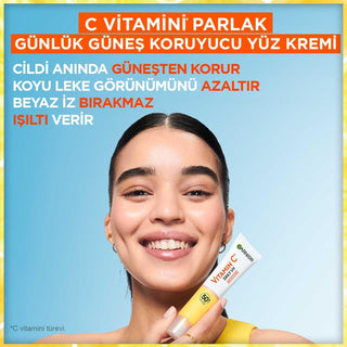 garnier c vitamin bright daily sunscreen fluid in 40ml, garnier sunscreen showing texture and packaging Garnier C Vitamin Bright Daily Sunscreen Fluid - SPF50 | 40ml Garnier C Vitamin Bright Daily Sunscreen SPF50 - 40ml garnier, c-vitamin, sunscreen, spf50, daily-skincare, skin-care, vegan, uv-protection, brightening, ai-generated