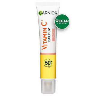 garnier c vitamin bright daily sunscreen fluid in 40ml, garnier sunscreen showing texture and packaging Garnier C Vitamin Bright Daily Sunscreen Fluid - SPF50 | 40ml Garnier C Vitamin Bright Daily Sunscreen SPF50 - 40ml garnier, c-vitamin, sunscreen, spf50, daily-skincare, skin-care, vegan, uv-protection, brightening, ai-generated