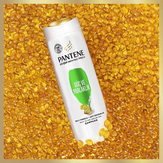 pantene pro-v strength shampoo bottle, labeled ingredients of pantene shampoo, stylish packaging of pantene pro-v shampoo Pantene Pro-V Strength & Shine Shampoo for Weak, Lifeless Hair | 11.8 fl oz Pantene Pro-V Strength Shampoo for Lifeless Hair pantene, shampoo, strengthening, lifeless-hair, hair-care, pro-v, glossy-hair, recycled-packaging, eco-friendly, ai-generated