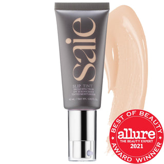 Saie Slip Tint - Lightweight Tinted Moisturizer with SPF 35, Hyaluronic Acid & Mineral Zinc Oxide for Natural Dewy Coverage Saie Slip Tint: Tinted Moisturizer with SPF 35 & Hyaluronic Acid tinted moisturizer, SPF 35, non-comedogenic, hyaluronic acid, mineral zinc oxide, gluten-free, cruelty-free, recyclable packaging, natural makeup coverage, sensitive skin friendly, dewy finish, lightweight, liquid formulation, clean beauty, sustainable beauty, everyday makeup, natural look, multi-tasking makeup