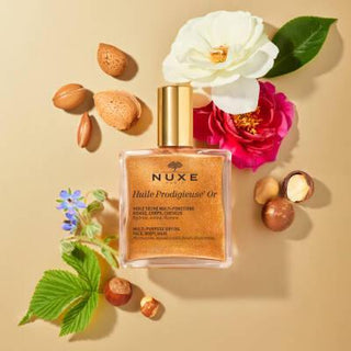 Nuxe Huile Prodigieuse Or: Shimmering Golden Dry Oil for Face, Body & Hair - Natural Multi-Purpose Illuminating Oil Nuxe Huile Prodigieuse Or: Shimmering Oil for Radiant Skin & Hair Nuxe Huile Prodigieuse Or, shimmering dry oil, golden shimmer oil, multi-purpose oil, natural beauty oil, face body hair oil, illuminating oil, pariltili kuru yag, altin pariltili yag, cosmetic oil, face oil, body oil, hair oil, natural ingredients, shimmering oil, golden oil, radiant skin, luminous skin, dry oil, non-greasy, hy