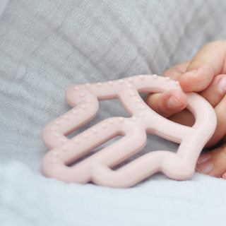 oi oi teething toy pinky pink front view, oi oi teething toy pinky pink side view, oi oi teething toy pinky pink in use OiOi Teething Toy - Pinky Pink | Baby Safe OiOi Teething Toy - Pinky Pink | Baby Safe oi-oi, teething-toy, baby-products, safe-silicone, infant-care, parents, teething-relief, motor-skills, baby-gift, ai-generated