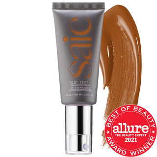 Saie Slip Tint - Lightweight Tinted Moisturizer with SPF 35, Hyaluronic Acid & Mineral Zinc Oxide Saie Slip Tint - Tinted Moisturizer with SPF 35 & Hyaluronic Acid tinted moisturizer, SPF 35, non-comedogenic, hyaluronic acid, mineral zinc oxide, clean beauty, cruelty-free, gluten-free, recyclable packaging, dermatologist-tested, skincare, makeup, face, natural look, dewy finish, sun protection, hydration, brightening, sensitive skin, fragrance-free
