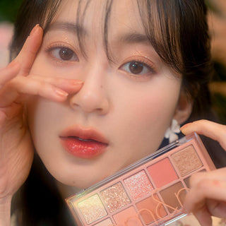 rom&nd Dreamy Lilac Garden Eyeshadow Palette: Create Stunning Eye Looks with Matte & Shimmer Shades, High Pigment Korean Eye Makeup rom&nd Dreamy Lilac Eyeshadow: Korean Palette, Matte & Shimmer rom&nd eyeshadow palette, Korean eyeshadow palette, matte shimmer eyeshadow, long lasting eyeshadow, eye makeup palette, Dreamy Lilac Garden eyeshadow, high pigment eyeshadow, blendable eyeshadow, eyeshadow, eye shadow, eye makeup, makeup, cosmetics, beauty, lilac eyeshadow, purple eyeshadow, Korean beauty, K-beauty