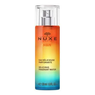 Nuxe Sun Eau Delicieuse Parfumante Body Spray - Tropical Summer Scent with Coconut & Tiare Flower | 30ml Nuxe Sun Body Spray: Tropical Coconut Summer Beach Scent Nuxe Sun fragrance, body spray, summer scent, tropical fragrance, coconut body mist, natural body spray, eau delicieuse parfumante, tiare flower perfume, sun inspired fragrance, beach scent, Nuxe, body mist, perfume, fragrance, tropical, coconut, tiare flower, natural, summer, beach, sweet orange, petitgrain, vanilla, musk, women's fragrance, light