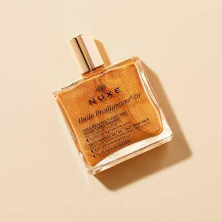 Nuxe Huile Prodigieuse Or: Shimmering Golden Dry Oil for Face, Body & Hair - Natural Multi-Purpose Illuminating Oil Nuxe Huile Prodigieuse Or: Shimmering Oil for Radiant Skin & Hair Nuxe Huile Prodigieuse Or, shimmering dry oil, golden shimmer oil, multi-purpose oil, natural beauty oil, face body hair oil, illuminating oil, pariltili kuru yag, altin pariltili yag, cosmetic oil, face oil, body oil, hair oil, natural ingredients, shimmering oil, golden oil, radiant skin, luminous skin, dry oil, non-greasy, hy