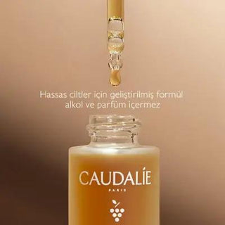 Caudalie Sunless Tanning Drops: Natural Bronzer with Hyaluronic Acid for Sunless Glow | Sensitive Skin Friendly Caudalie Sunless Tanning Drops - Natural Bronzer & Sunless Glow sunless tanning drops, natural bronzer, DHA self-tanner, hyaluronic acid tanning, paraben-free tanner, sensitive skin tanner, Caudalie tanning drops, self-tanning serum, sunless glow, natural self tanner, self tanner, tanning serum, natural tan, sunless tan, hyaluronic acid, grape water, natural ingredients, paraben free, silicone fre