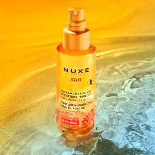 Nuxe Sun: UV Protection Moisturizing Hair Oil - Water Resistant Beach & Summer Hair Care, Protects from Sun, Salt & Chlorine - 3.38 fl oz Nuxe Sun Hair Oil - UV Protection, Moisturizing for Beach & Summer hair oil, sun protection hair, moisturizing hair oil, UV protection hair spray, water resistant hair protection, beach hair protection, summer hair care, Nuxe Sun hair oil, hair sunscreen, chlorine protection hair, hair care, UV protection, moisturizing, water-resistant, lightweight, summer fragrance, dual