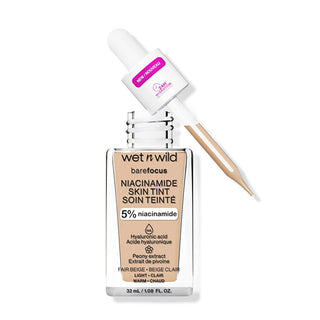 Wet n Wild Niacinamide Skin Tint Fondöten Fair Beige - product view, Wet n Wild Niacinamide Skin Tint Fondöten Fair Beige - swatch, Wet n Wild Niacinamide Skin Tint Fondöten Fair Beige - with packaging Wet n Wild Niacinamide Skin Tint Fondöten - Lightweight Formula for Natural Coverage | Fair Beige Wet n Wild Niacinamide Skin Tint - Fair Beige wet-n-wild, niacinamide-skin-tint, lightweight-foundation, fair-beige, makeup, beauty, cosmetics, skin-friendly, hydration, ai-generated