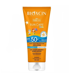 bioxcin suncare kids lotion spf50+ bottle, children protecting skin with sunscreen Bioxcin Suncare Kids Lotion SPF50+ - High Protection | 200 ml Bioxcin Suncare Kids Lotion SPF50+ | 200 ml bioxcin, suncare, kids-sunscreen, spf50+, sensitive-skin, moisturizing-lotion, sun-protection, water-resistant, children, ai-generated