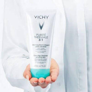 vichy purete thermale 3-in-1 cleanser bottle, vichy 3-in-1 cleanser application on cotton pad Vichy Purete Thermale 3-in-1 Cleanser - Effective Skincare | 200ml Vichy Purete Thermale 3-in-1 Cleanser 200ml vichy, cleanser, skincare, makeup-remover, hydrating-cleanser, daily-cleanser, dermatologically-tested, oil-free, hypoallergenic, ai-generated